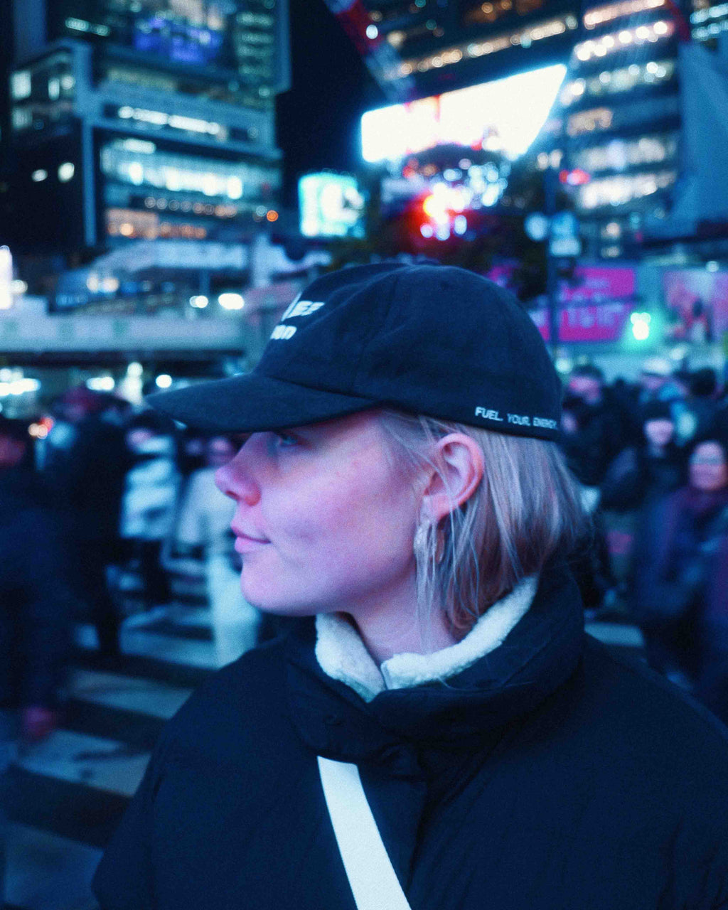 female model wearing Union.dsgn cap in city