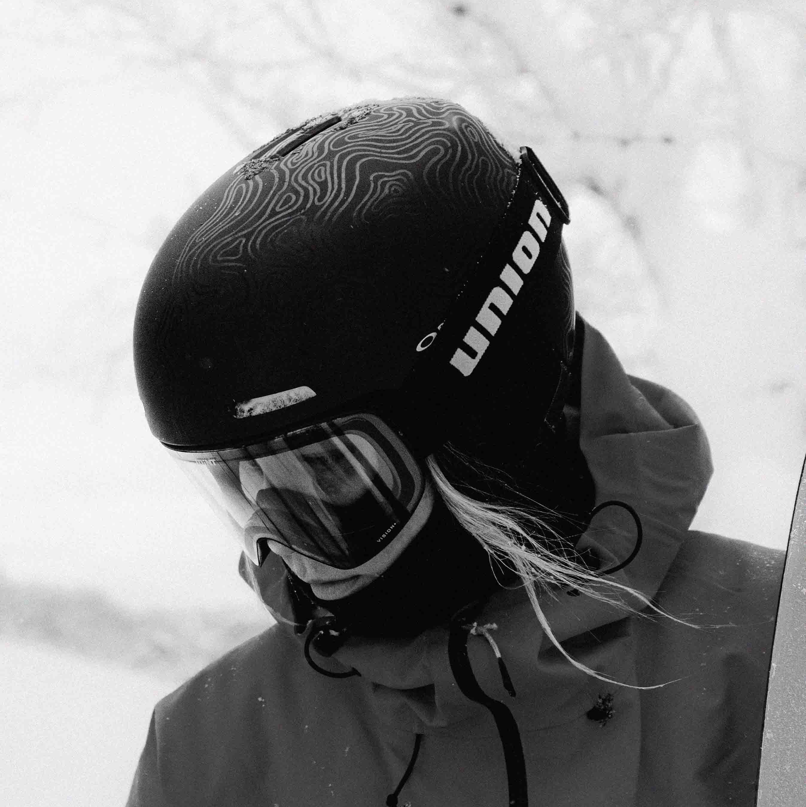 Person wearing Union.dsgn goggles, standing in a snowy landscape.
